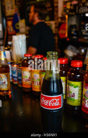 A vintage Coca-Cola bottle on the bar inside Sun Studio Recording Services reception area for tourists, Memphis TN Stock Photo