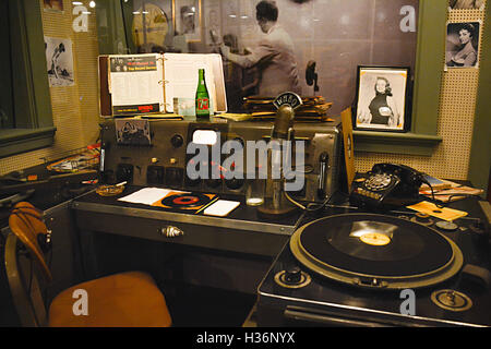 A 'Frozen in Time' look Inside Sam Phillips' vintage recording booth full of equipment & turntables & photos at Sun Records Studio in Memphis, TN, USA Stock Photo