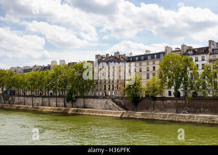 View of buildings showing French architectural style by Seine river in Paris Stock Photo