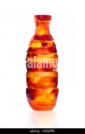 Bottle made from sliced nectarine on white Stock Photo