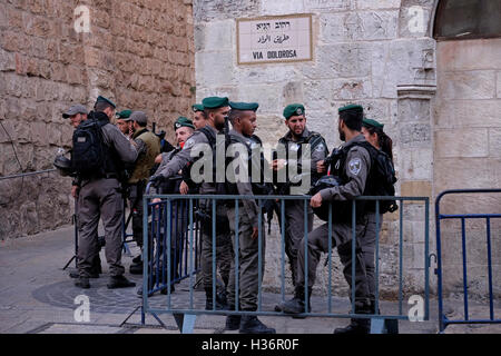 Members of the Israeli Security Forces stand guard in Via Dolorosa street also called in Arabic Al Wad street in the Muslim Quarter Old city East Jerusalem Israel Stock Photo