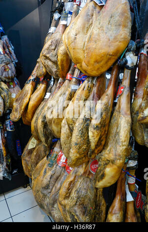 A display of different brands of Spanish cured Ham, Jamon Serrano in a supermarket in Spain. Stock Photo