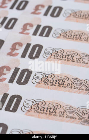 Rows of old design £10 banknotes as concept for UK currency, wages, the economy, inflation, quantitative easing (QE), and Bank of England. Stock Photo