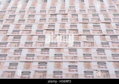Rows of old design £10 banknotes as concept for UK currency, wages, the economy, inflation, quantitative easing (QE), and Bank of England. Stock Photo
