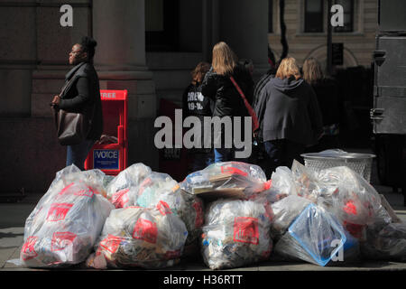 Garbage bags along the sidewalk of Broadway in Lower Manhattan.New York City. USA Stock Photo