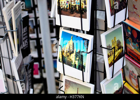 Close up view of French postcards on racks about Church on Rue Montorgueil street in Paris. Stock Photo