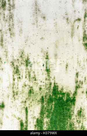 Abstract background on green metal plate, with peeling plaster. Stock Photo