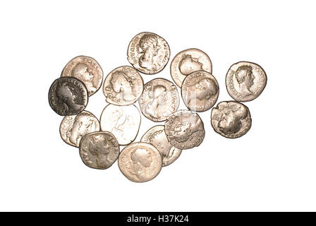 Many ancient silver coins on white Stock Photo