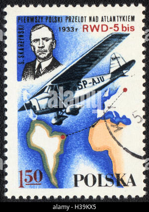A postage stamp printed in Poland shows airplane SP-AJU and pilot of S.Skarzinski,  circa 1982 Stock Photo