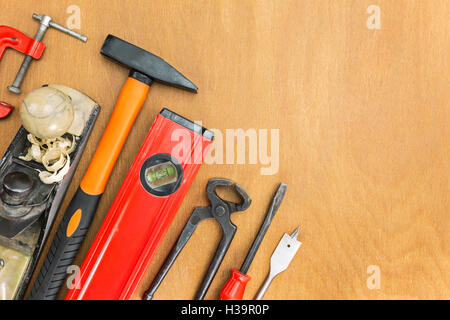 Assorted construction work tools on wooden background Stock Photo