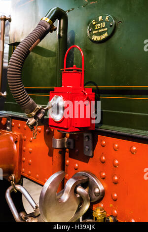 Warning lamps.Old Swindon railway works. Britain.  Rear light and brass builders plate on water and coal tender of City of Truro Stock Photo