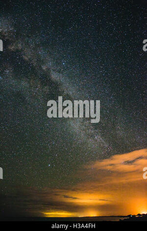 The Milky Way and its satellite galaxies the Magellanic Clouds rising ...