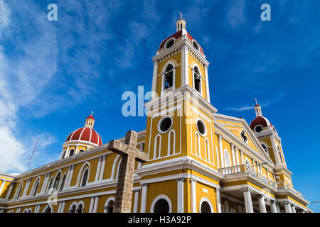 A horse & cart travels along a street in downtown Granada in Stock Photo