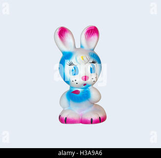 Old rubber toy in form of a colored rabbit for young children Stock Photo