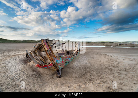 An old boat wreck on the beach at Crow Point on the edge of Saunton Sands in Devon Stock Photo