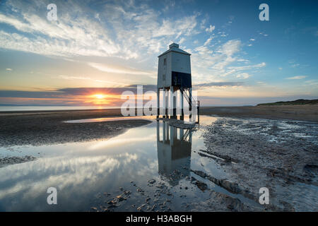 Sunset over the lighthouse at Burnham on Sea on the Somerset Coast Stock Photo