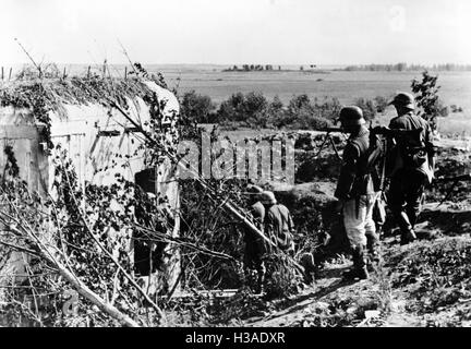 German infantry before a Soviet bunker, 1941 Stock Photo