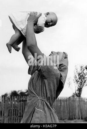 BDM girl as child care worker, 1941 Stock Photo