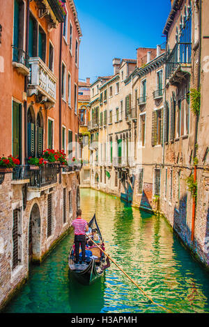 Beautiful scene with traditional gondola on a canal in Venice, Italy Stock Photo