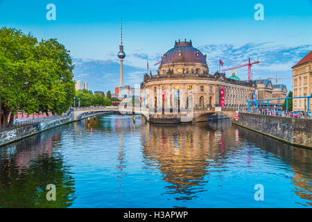 Beautiful view of historic Berlin Museumsinsel with famous TV tower and Spree river in twilight during blue hour at dusk, Berlin Stock Photo