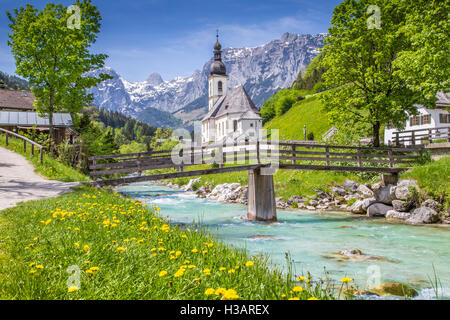 Scenic mountain landscape in the Alps with famous Parish Church of St. Sebastian in the village of Ramsau in springtime, Berchtesgadener Land, Germany Stock Photo