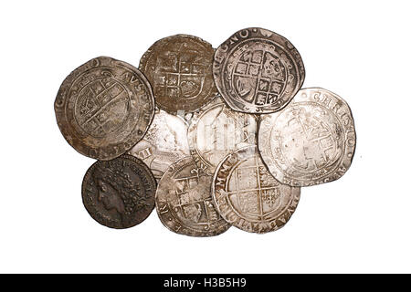 Many ancient silver coins on white Stock Photo