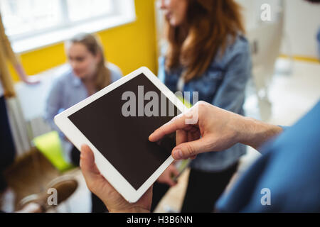 Midsection of businessman using digital tablet Stock Photo