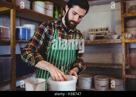 Bearded man working at workshop Stock Photo