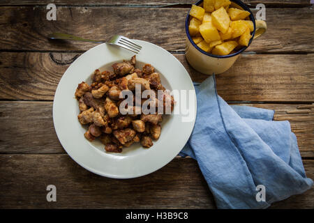 Portion Of Fried Greaves On Black Plate On Dark Background. Homemade 