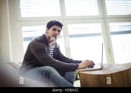 Confident photo editor using laptop Stock Photo