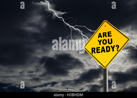 Are You Ready road sign against a dark, cloudy and thunderous sky. Conceptually warning of danger ahead. Stock Photo