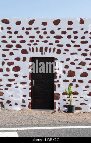 Fuerteventura, Canary Islands, North Africa, Spain: a cactus and details of a house built in the colonial Spanish architecture in the village of Tefia Stock Photo