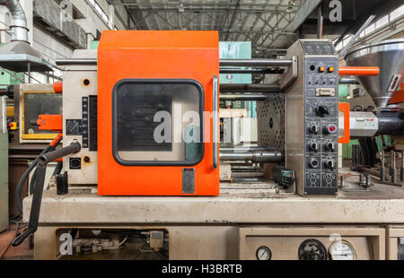 Injection molding thermoplastic machine close up Stock Photo