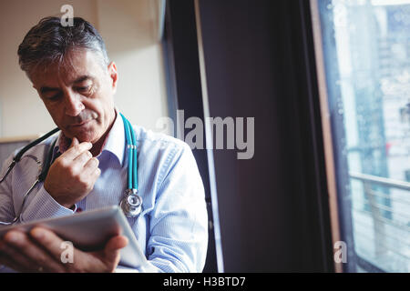 Doctor using digital tablet Stock Photo