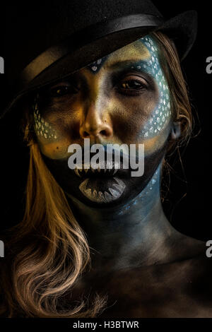 Female alien horror creature, special effects creative make up lighting portrait Stock Photo