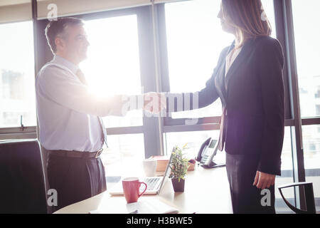 Businesswoman and businesswoman shaking hands Stock Photo