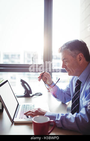 Businessman working on laptop Stock Photo