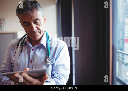 Doctor using digital tablet Stock Photo