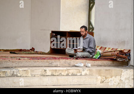 Muslim man praying during Ramadan in the Gazi Husrev-beg Mosque, Sarajevo, Bosnia and Herzegovina Stock Photo