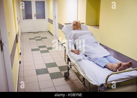Senior woman lying on a stretcher Stock Photo