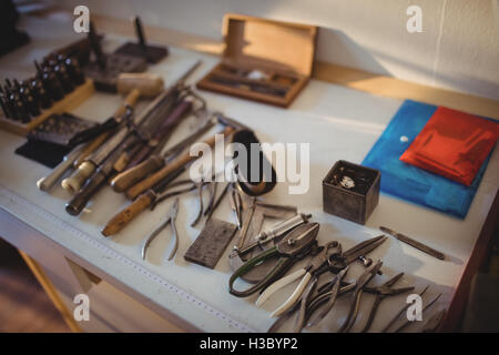 Goldsmith work tools on workbench Stock Photo