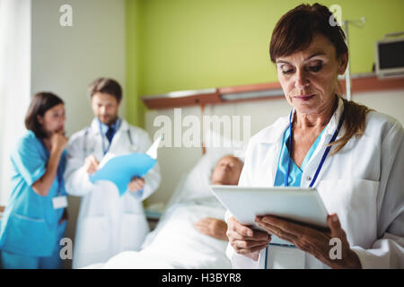 Female doctor using digital tablet Stock Photo