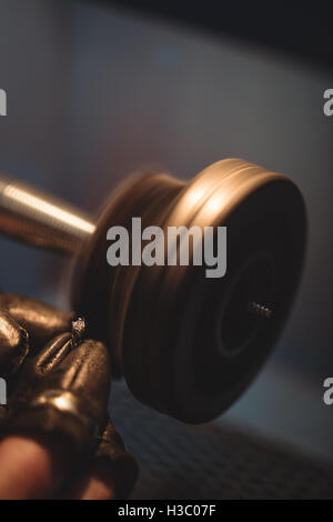 Goldsmith polishing ring in workshop Stock Photo