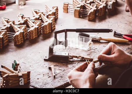 Piano technician working on piano parts Stock Photo
