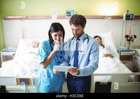Doctor and nurse using digital tablet Stock Photo