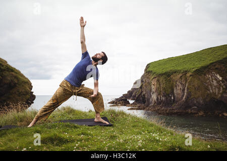 Man performing stretching exercise Stock Photo