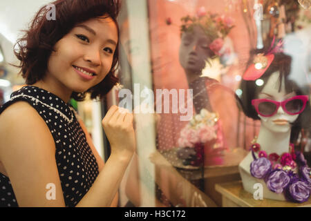 Portrait of woman doing window shopping Stock Photo