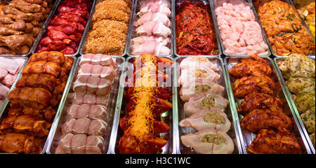 Variety of marinated meat at display counter Stock Photo