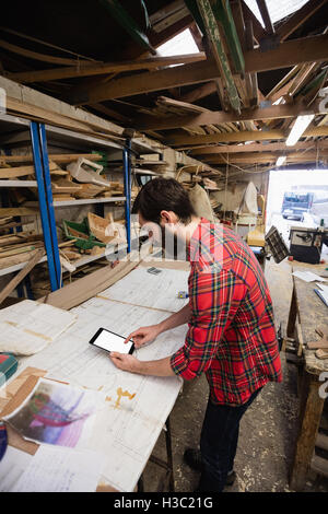 Man using digital tablet Stock Photo