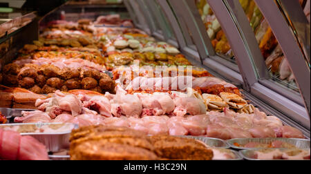 Variety of marinated meat at display counter Stock Photo